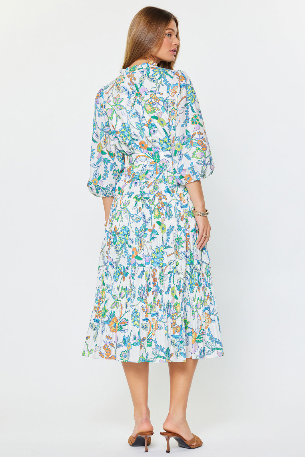 Woman wearing a floral dress on a white background
