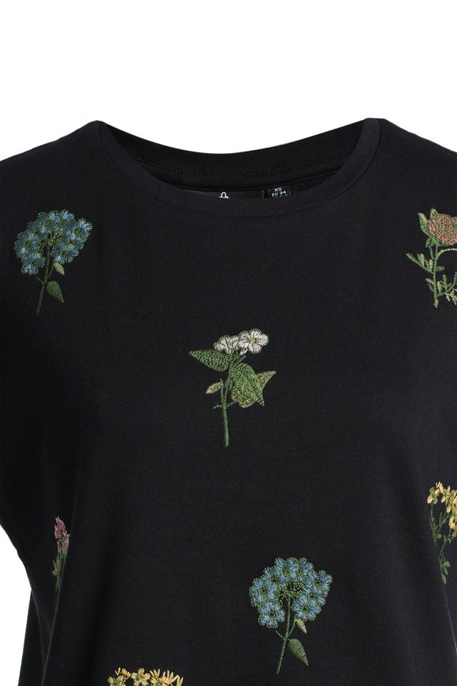 Black t-shirt with floral embroidery on a white background