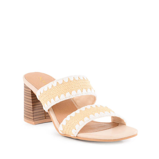 Beige and white sandal with wooden block heel on a white background