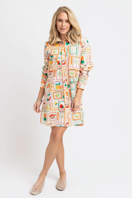 Woman wearing a patterned dress on a white background